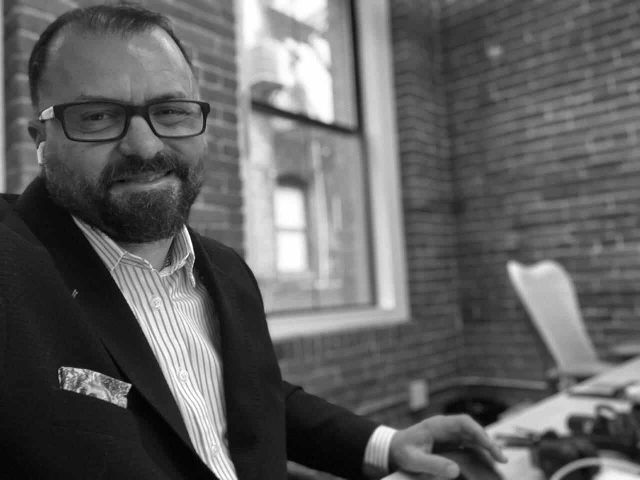 Man in suit at window